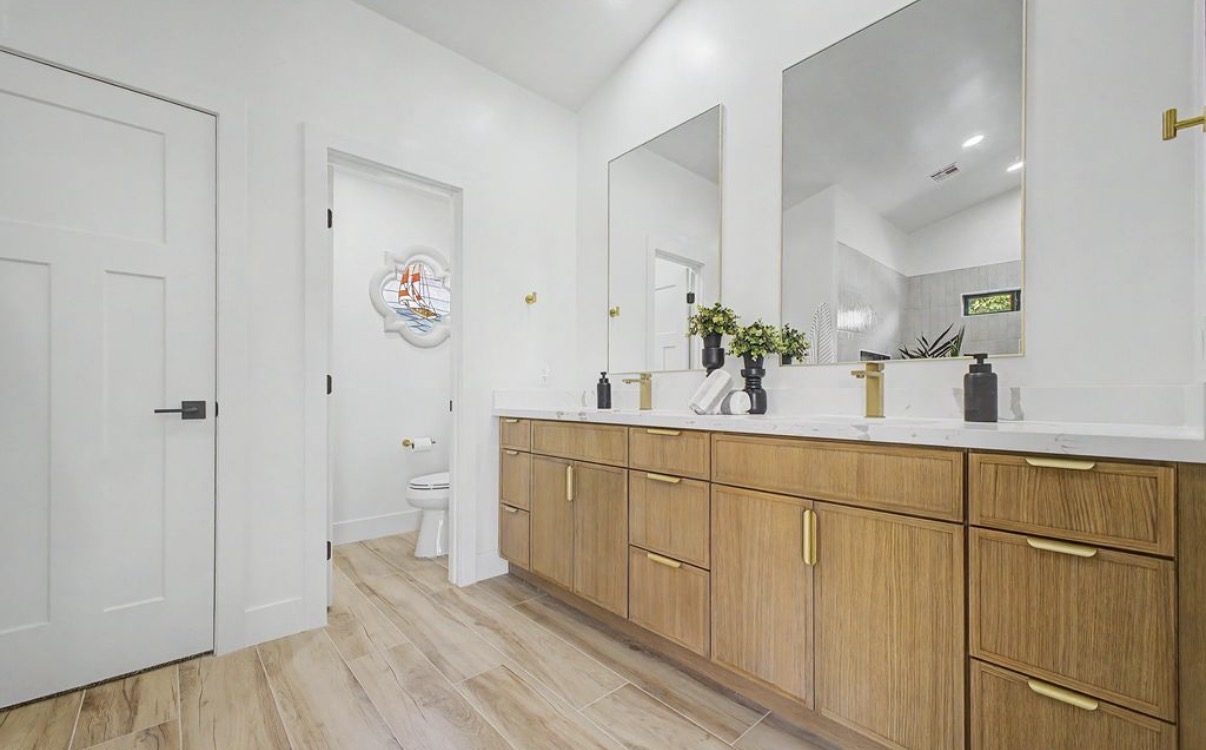 Bathroom with white oak vanity and gold fixtures