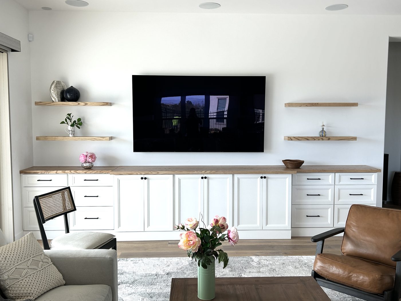Media Wall — White cabinetry with ash floating shelves
