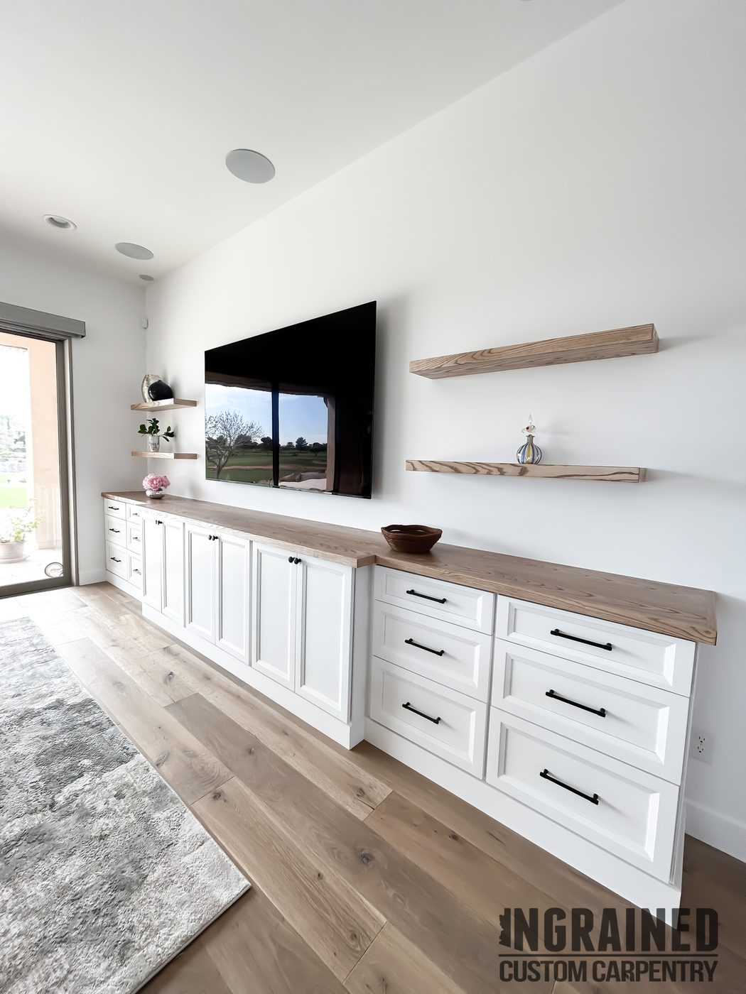 Media Wall — White cabinetry · floating ash shelves