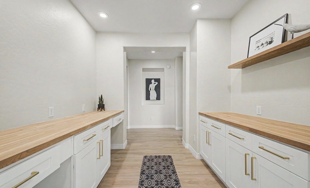 Butler's pantry with butcher-block counters and custom base cabinets