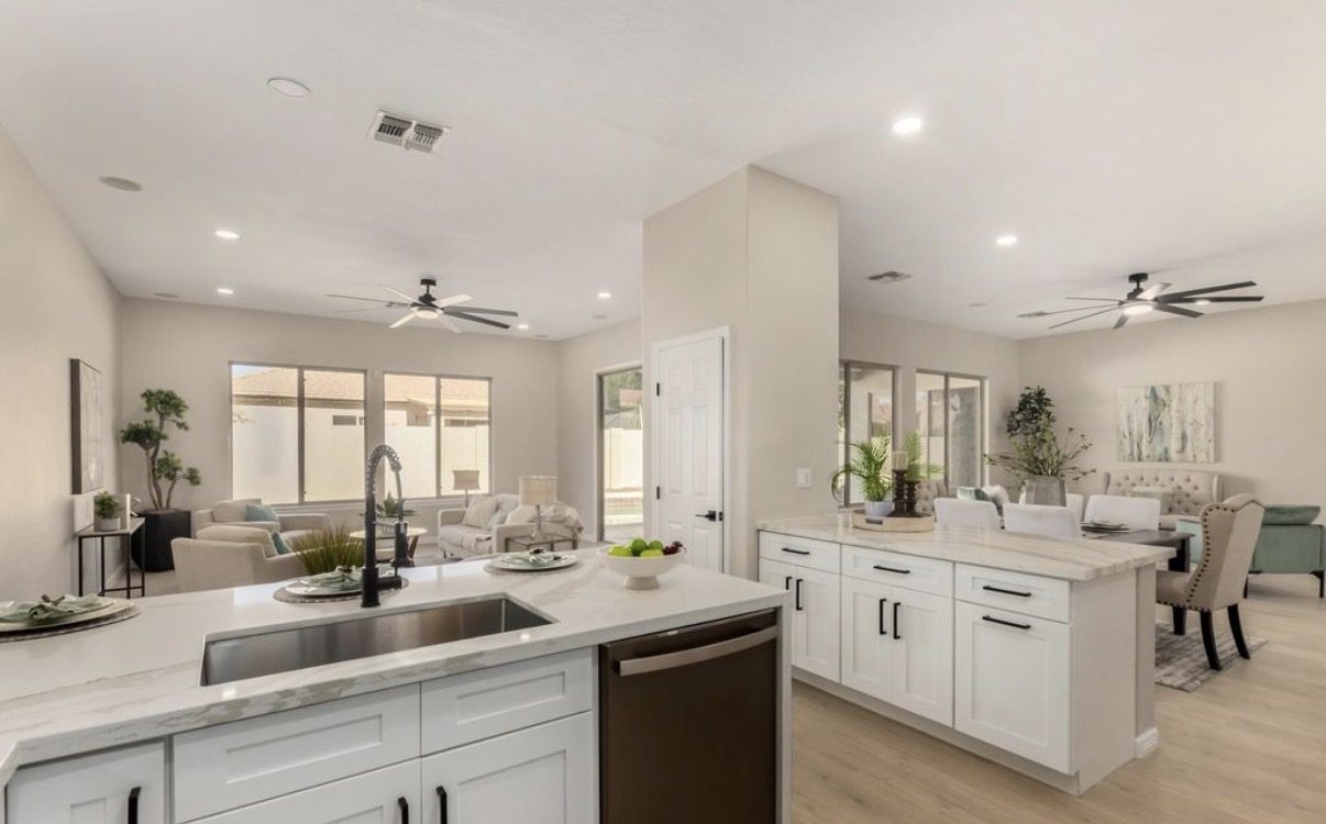 Open-concept kitchen with marble waterfall island and built-in sink