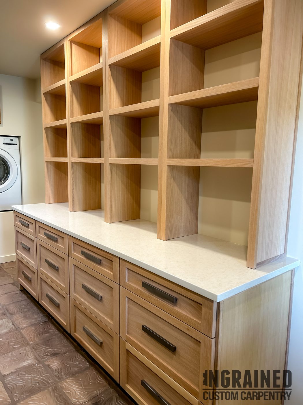 Laundry Storage — White oak cubbies · quartz top