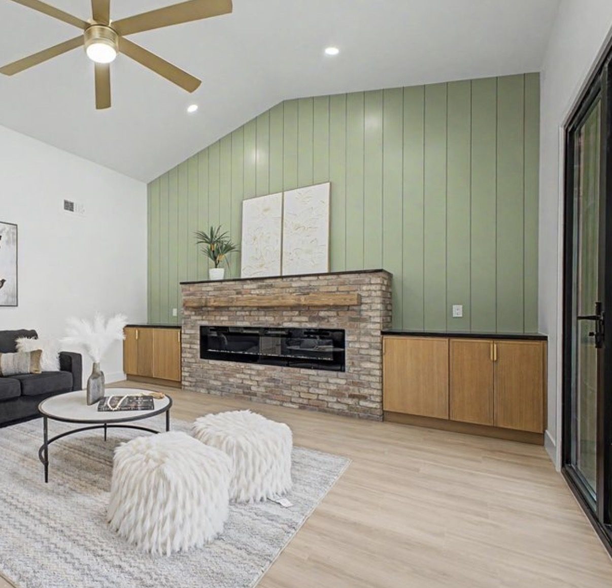 Living room with fireplace built-ins and floating cabinetry