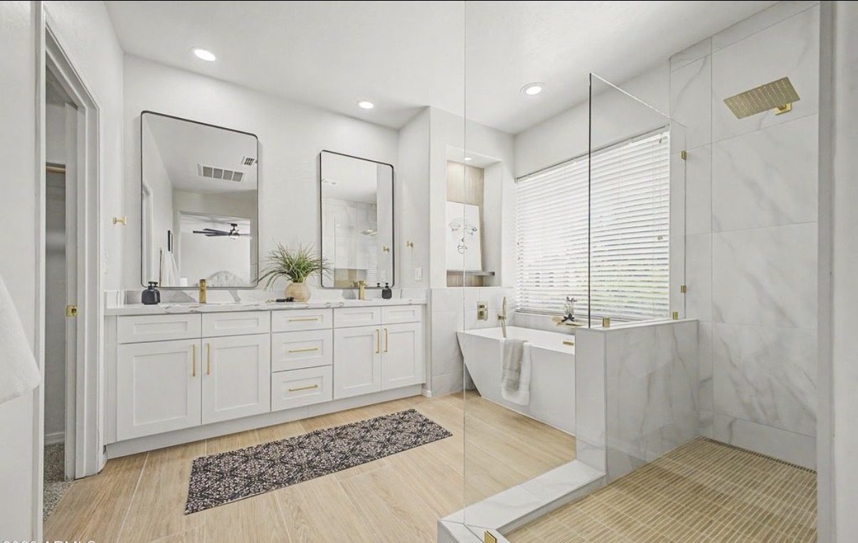 Master bathroom with custom double vanity and soaking tub